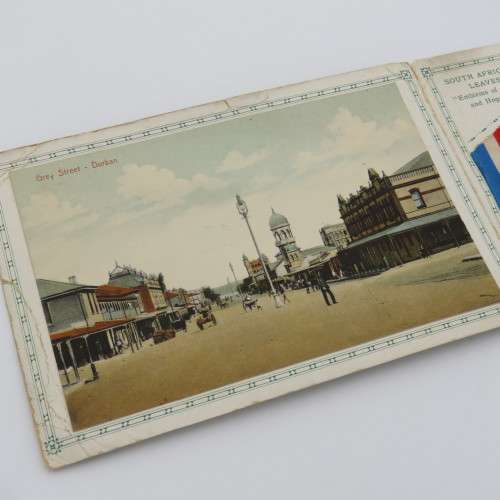 Antique souvenir card from Durban with Ricksha Puller, Grey street, street view and silver leaves