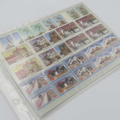 Lot of 9 folders with more than 200 SWA mint stamps