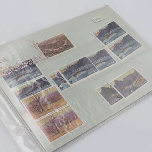 Lot of 9 folders with more than 200 SWA mint stamps