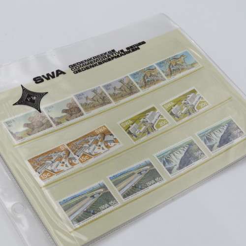 Lot of 9 folders with more than 200 SWA mint stamps