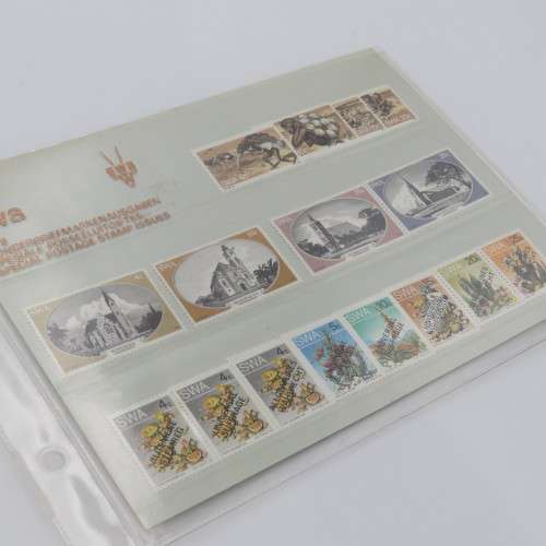 Lot of 9 folders with more than 200 SWA mint stamps