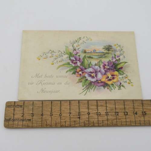 December 1920 Afrikaans Christmas postcard with flowers