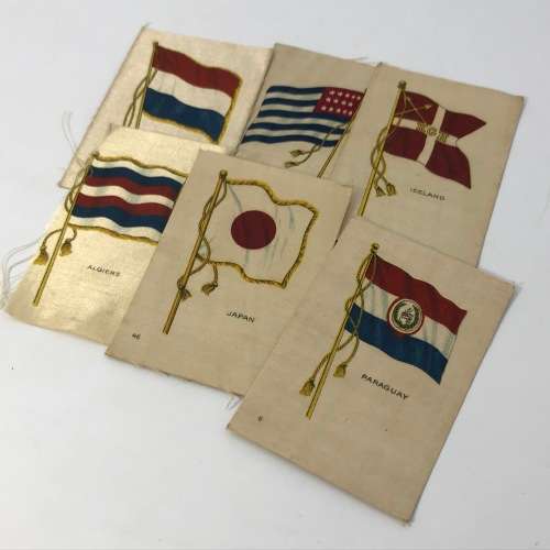 Lot of 27 Flags of all Nations silk cigarette cards on paper backing