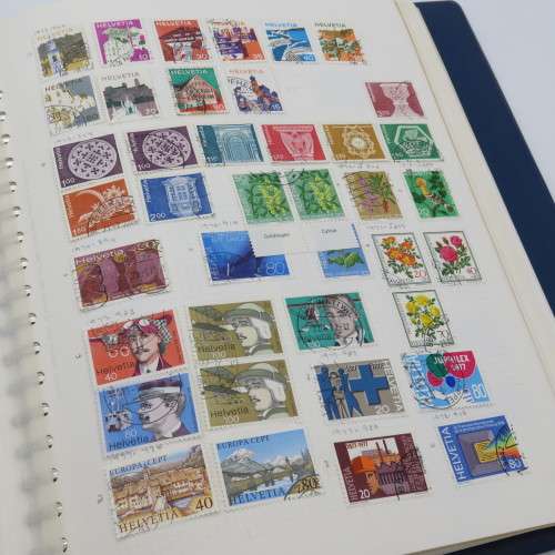 Album with over 1100 stamps including Transkei and Venda mint collections and a lot of USA stamps