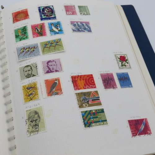 Album with over 1100 stamps including Transkei and Venda mint collections and a lot of USA stamps