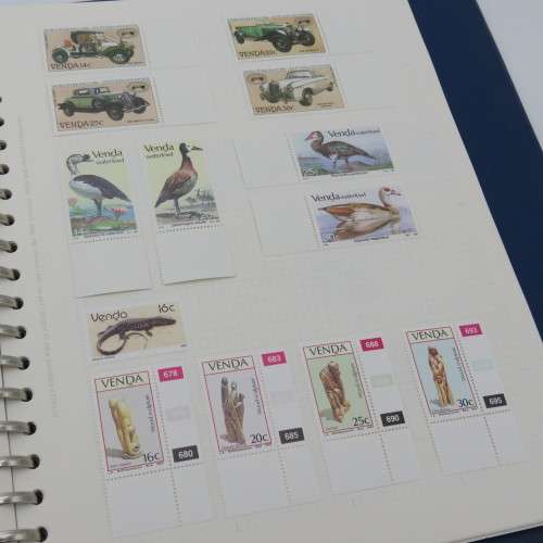 Album with over 1100 stamps including Transkei and Venda mint collections and a lot of USA stamps