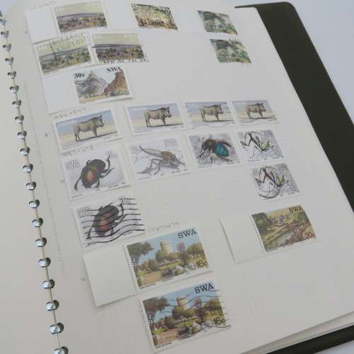 Album with over 1850 stamps - Many mint condition