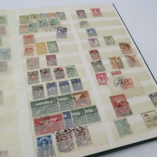 World collection with over 1700 stamps in decent 32 page album - Many better stamps