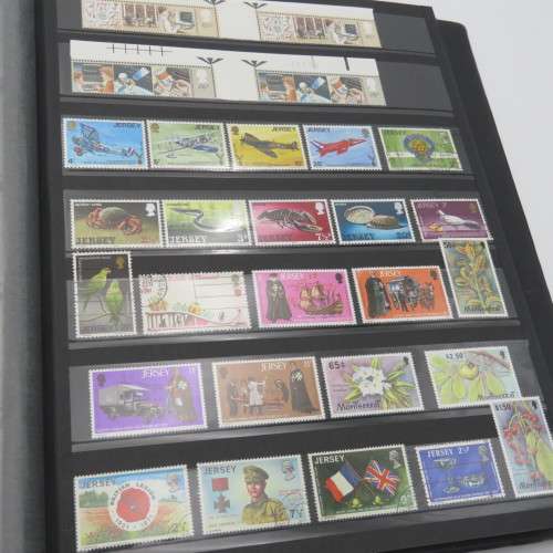Stamp album with over 1070 stamps - England Jersey Isle of man Gibraltar mint and used