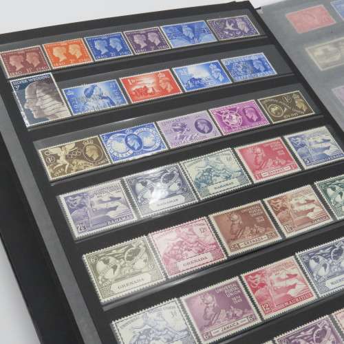 Stamp album with over 1070 stamps - England Jersey Isle of man Gibraltar mint and used