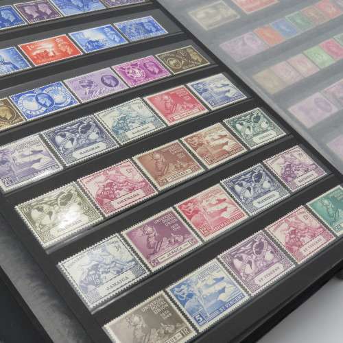 Stamp album with over 1070 stamps - England Jersey Isle of man Gibraltar mint and used