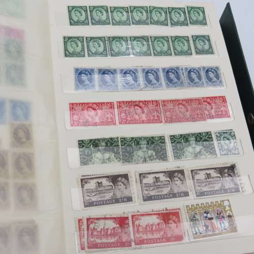 18 Page stamp album with over 700 British stamps - Including penny brown and some scarcer stamps
