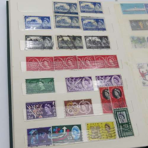 18 Page stamp album with over 700 British stamps - Including penny brown and some scarcer stamps