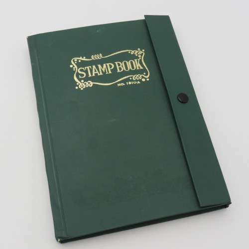 18 Page stamp album with over 700 British stamps - Including penny brown and some scarcer stamps