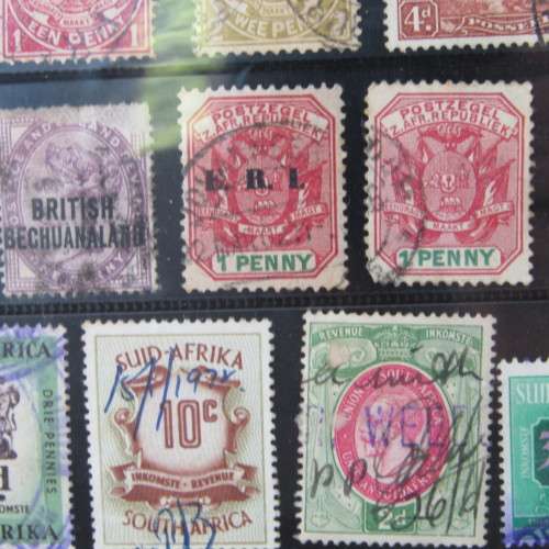 Album with over 1000 stamps - Ascension, Basutoland, Lesotho, Botswana and more