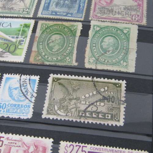 Stamp Album with over 1100 stamps - mint and used - some very good sets with album