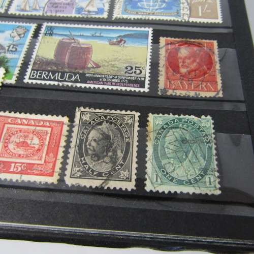 Stamp Album with over 1100 stamps - mint and used - some very good sets with album