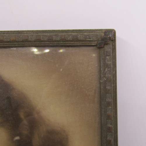 Vintage photo frame with antique coloured picture