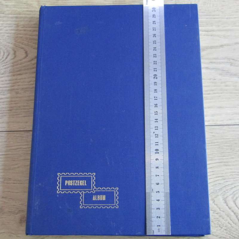 Stamp album with about 850 stamps - most in blocks or control blocks - some early ones