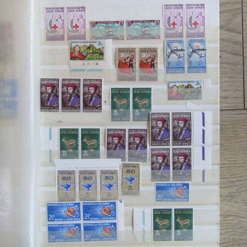 Stamp album with about 850 stamps - most in blocks or control blocks - some early ones
