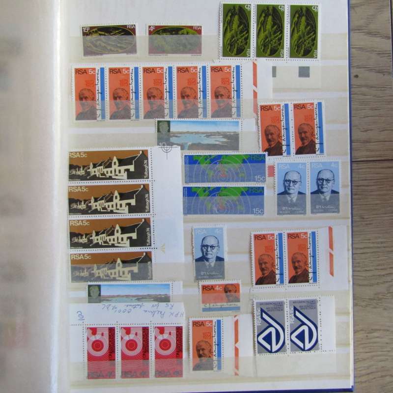 Stamp album with about 850 stamps - most in blocks or control blocks - some early ones