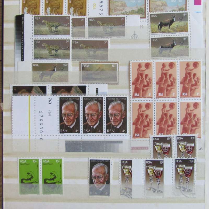 Stamp album with about 850 stamps - most in blocks or control blocks - some early ones