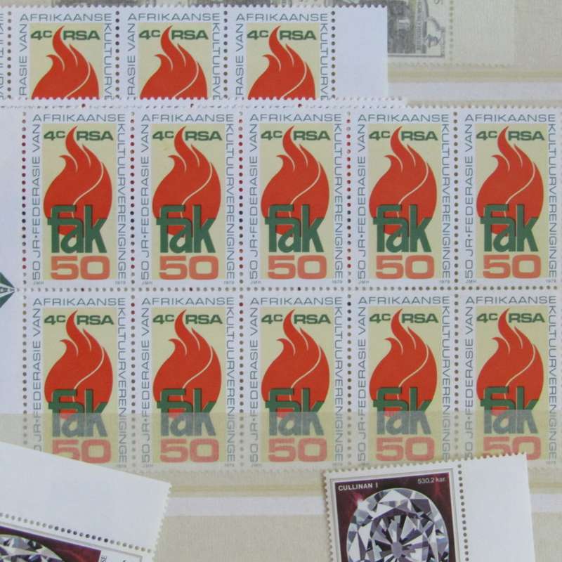 Stamp album with about 850 stamps - most in blocks or control blocks - some early ones