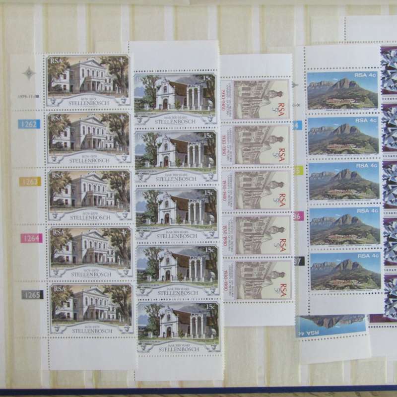 Stamp album with about 850 stamps - most in blocks or control blocks - some early ones