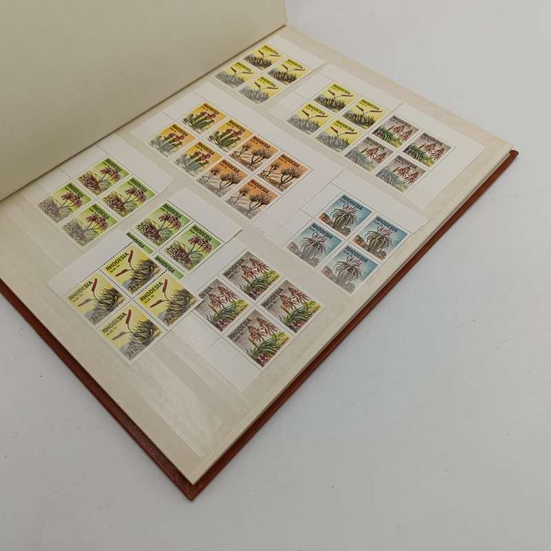 16 page album with over 450 Rhodesia mint stamps