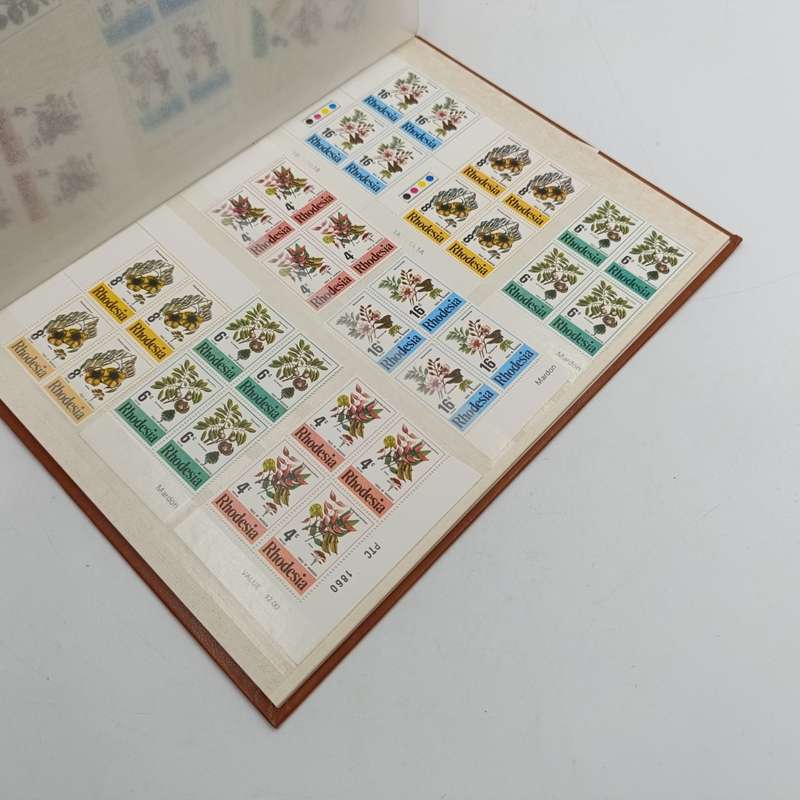 16 page album with over 450 Rhodesia mint stamps