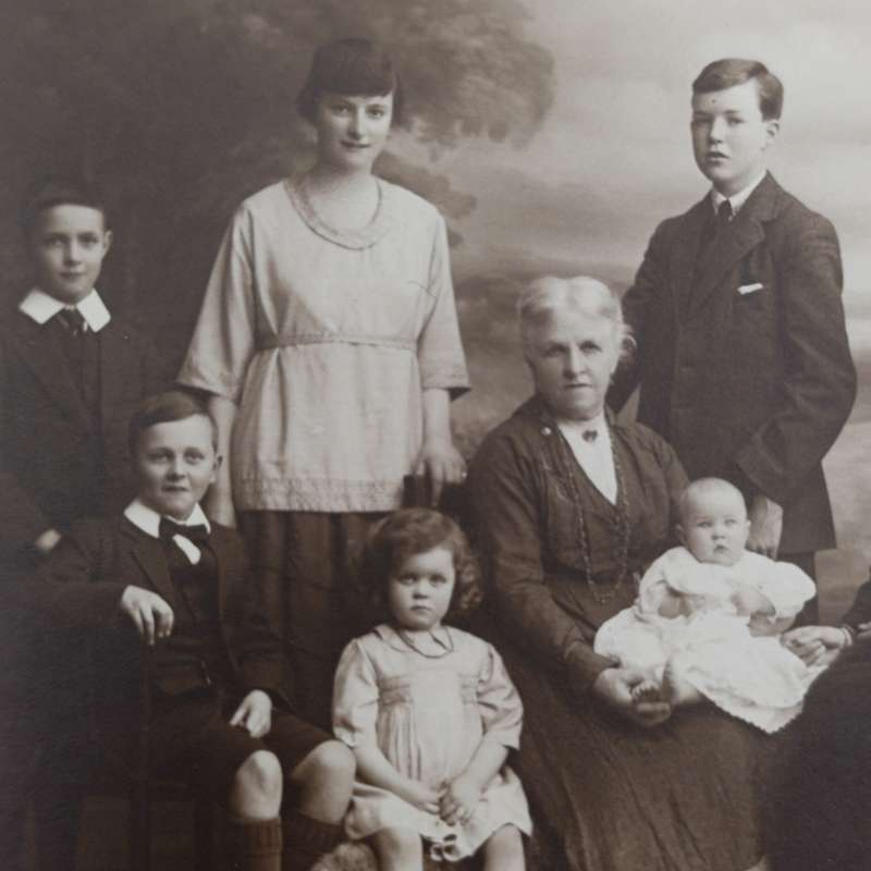 Antique Studio photo of Grandmother, mother and 8 children - note the doll set in Burnley area