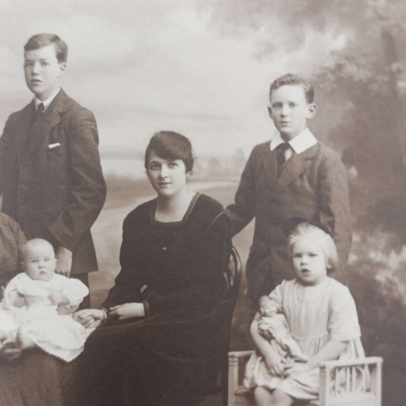 Antique Studio photo of Grandmother, mother and 8 children - note the doll set in Burnley area