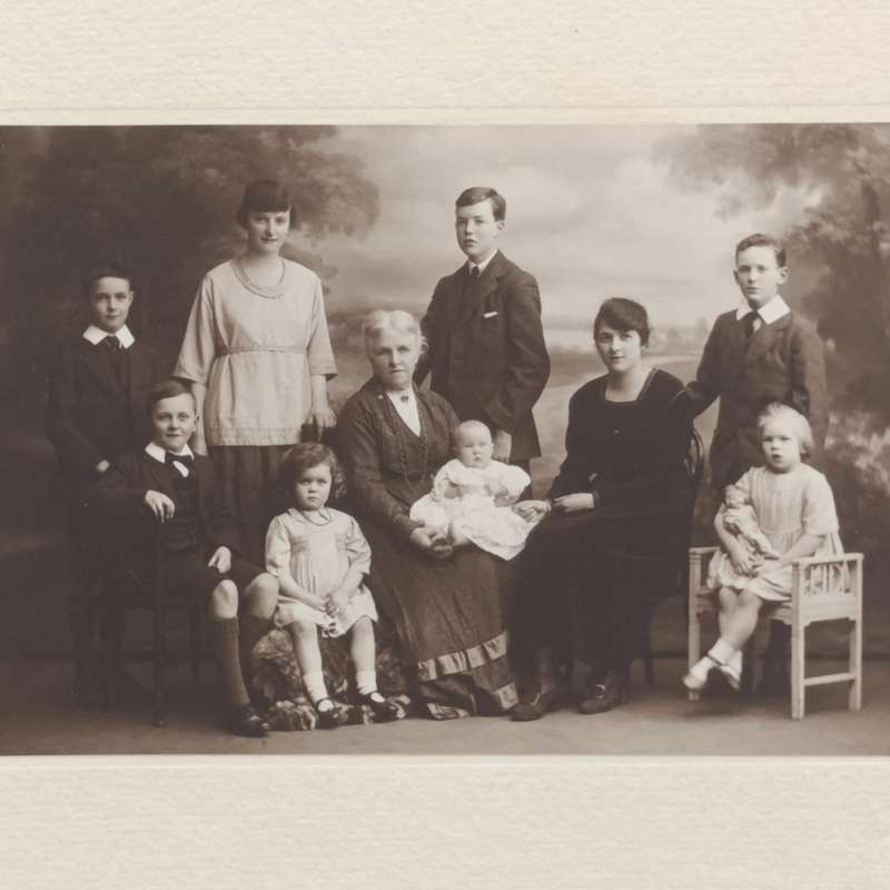 Antique Studio photo of Grandmother, mother and 8 children - note the doll set in Burnley area