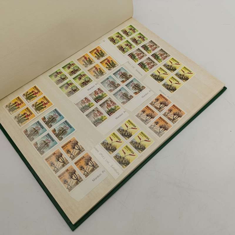 Excellent 16 page album with almost 600 Rhodesia mint stamps
