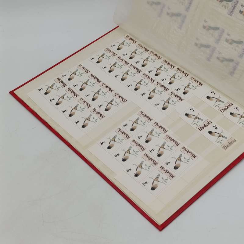 Excellent condition 16 page stamp album with 380 mint stamps and 120 mint Aloe stamps