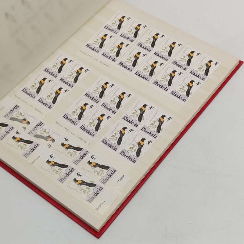 Excellent condition 16 page stamp album with 380 mint stamps and 120 mint Aloe stamps