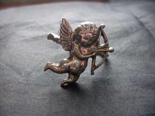 One single cupid napkin ring. He is adorable