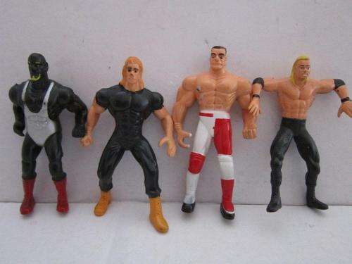4 x WWE Hard Rubber Static Wrestlers