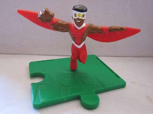 Superhero figure on piece of wimpy jigsaw +-7cm Hard Plastic