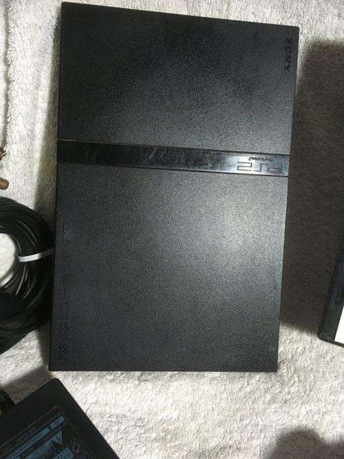 Playstation 2 - Black Slim Line Console c/w 1 x New Generic Controller, AV Cable PSU & 1 x Game