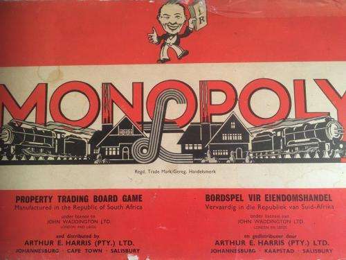 Vintage Monopoly UK Version with Wooden Houses and Hotels and Metal Playing Pieces (Circa 1950`s)