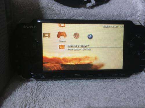 PSP 3004, 512MB Memory Card Charger, 5 Games + 4 UMD Music videos