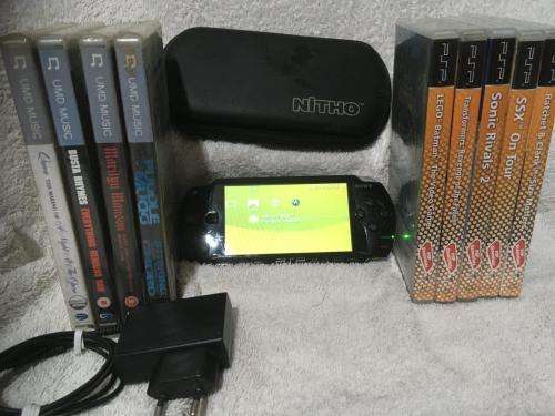 PSP 1001, 2GB Memory Card Charger, Carry Case 5 Games + 4 UMD Music videos