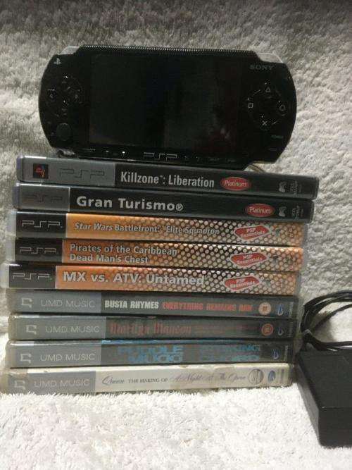PSP 1004, 32MB Memory Card Charger, 5 Games + 4 UMD Music videos + Starter Kit