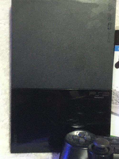 Playstation 2 - Black Slim Line Console c/w 1 x Original Controller, AV + Power Cable 1 x Game