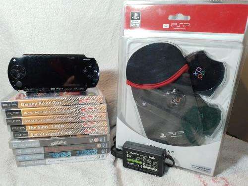 PSP 1004 Black, 32MB Memory Card, Charger, 5 Games + 4 UMD Music videos + Starter Kit