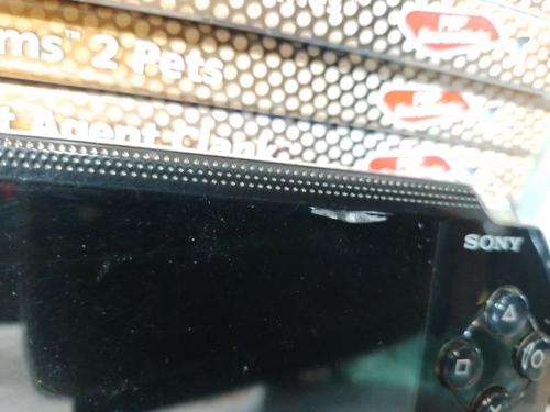 PSP 1004 Black, 32MB Memory Card, Charger, 5 Games + 4 UMD Music videos + Starter Kit