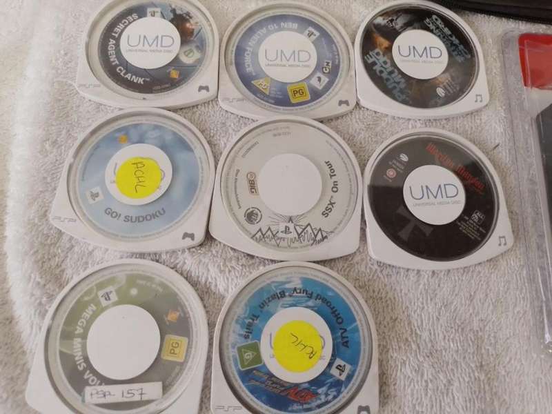 PSP 1000,  Charger, 5UMD Games + 2 UMD Music videos loose + Carry case (512mb Memory Card)