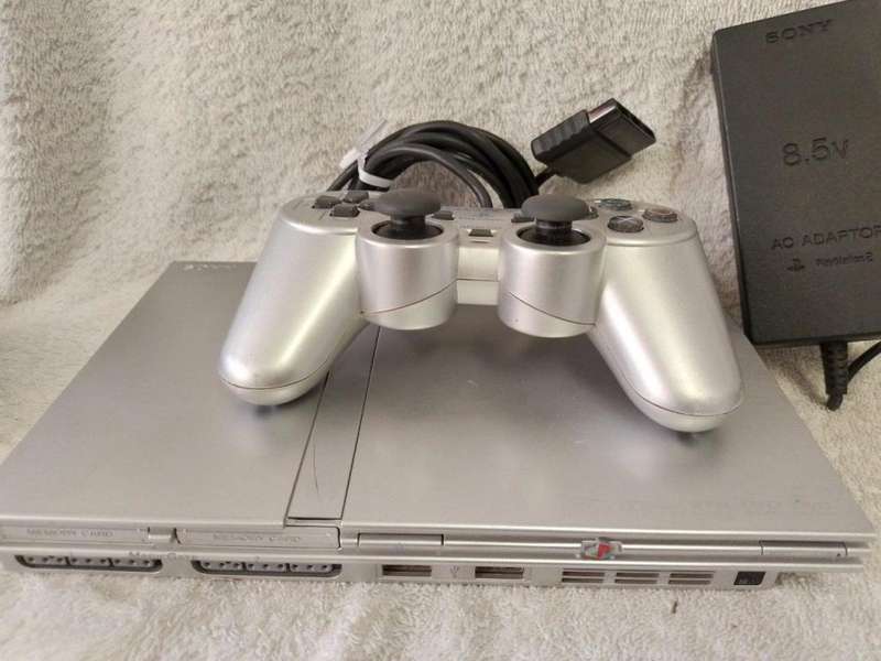 Playstation 2 - Platinum Silver Slim c/w 1 x Official Sony Controller, AV Cable & Power adapter
