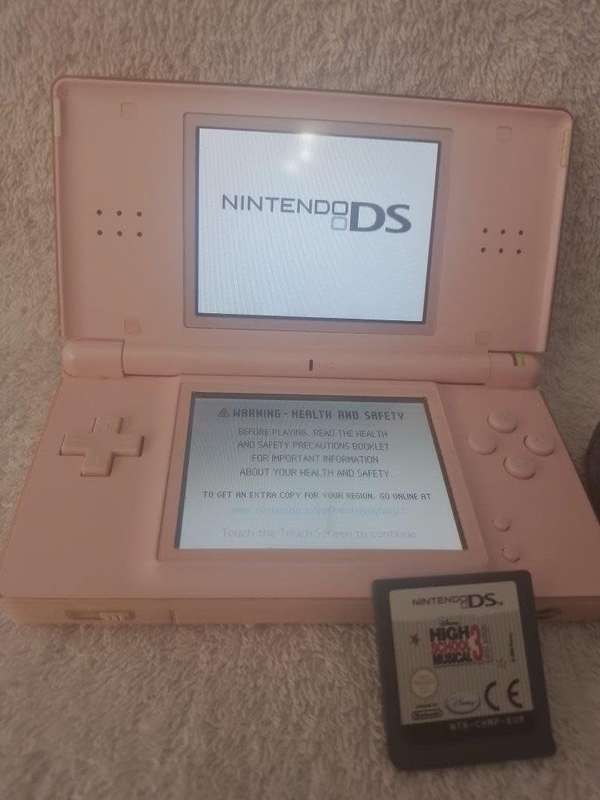Nintendo DS Lite Pink, c/w Stylus, Charger + High School Musical 3 Cartridge.